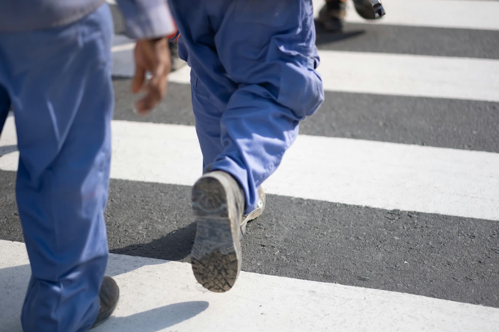 People in workwear walking together